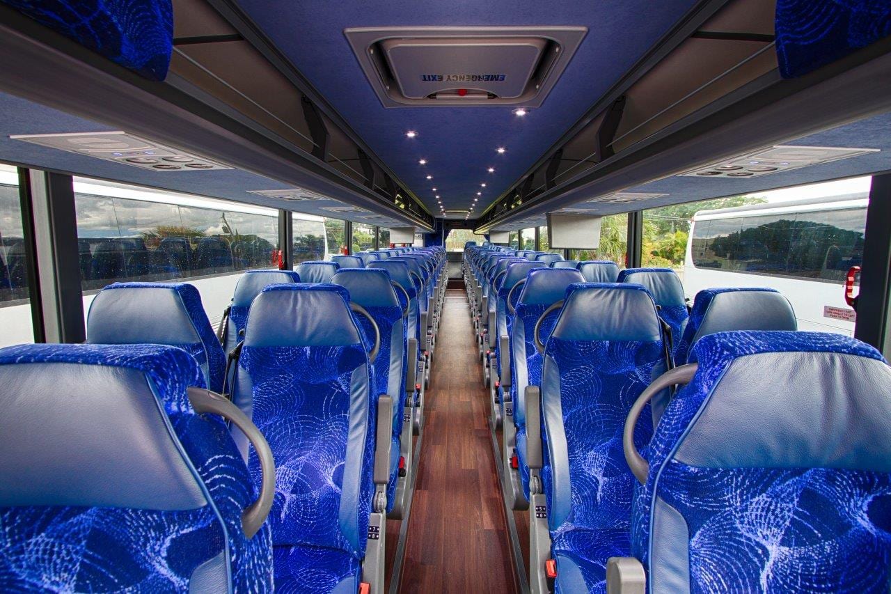 A Jet Set Express coach parked near the shore